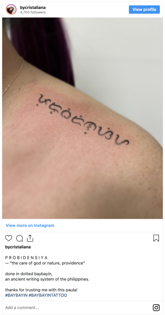 An instagram post of a baybayin tattoo on a woman's shoulder.